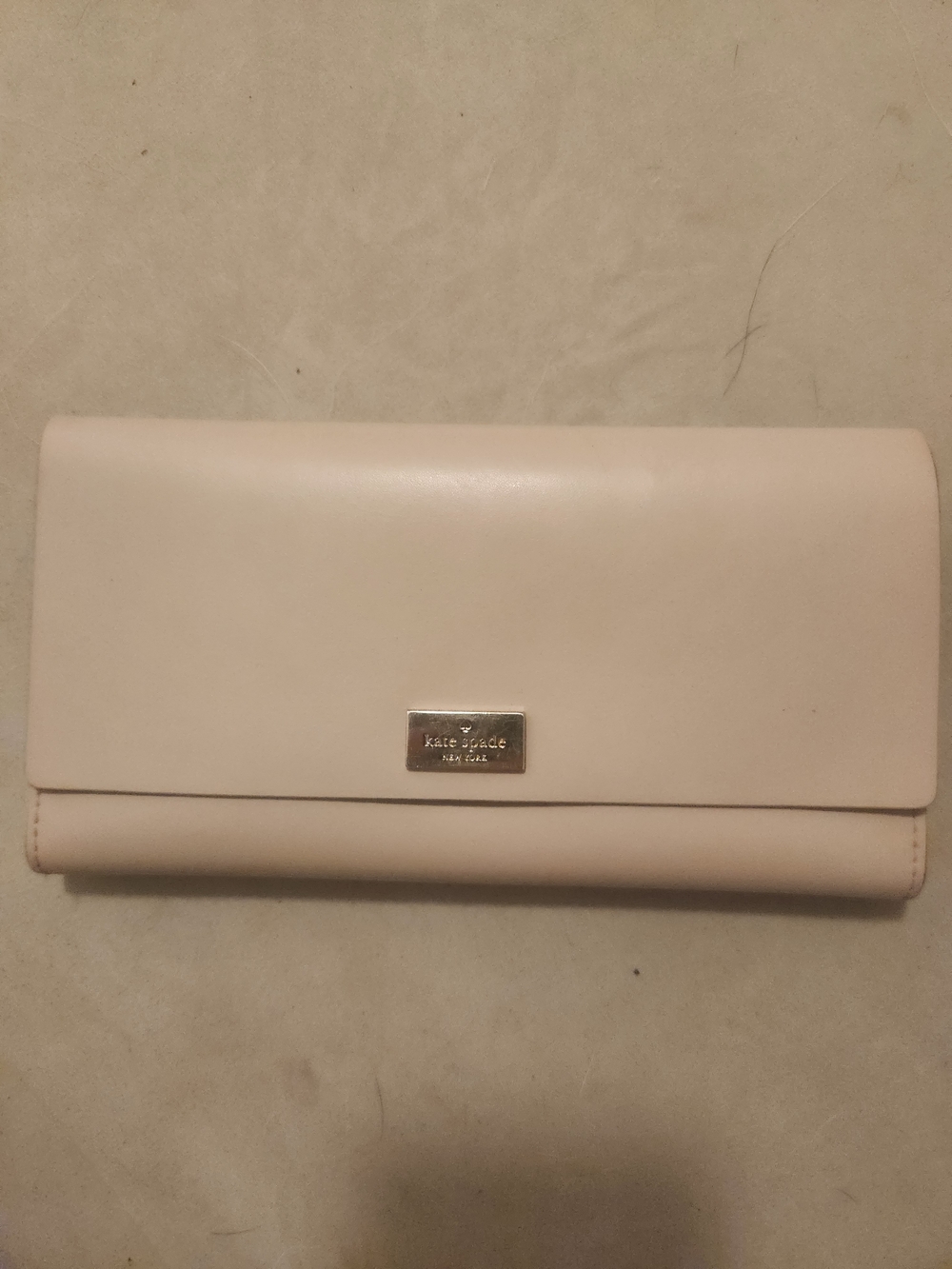 kate spade pale pink leather continental wallet with metal logo